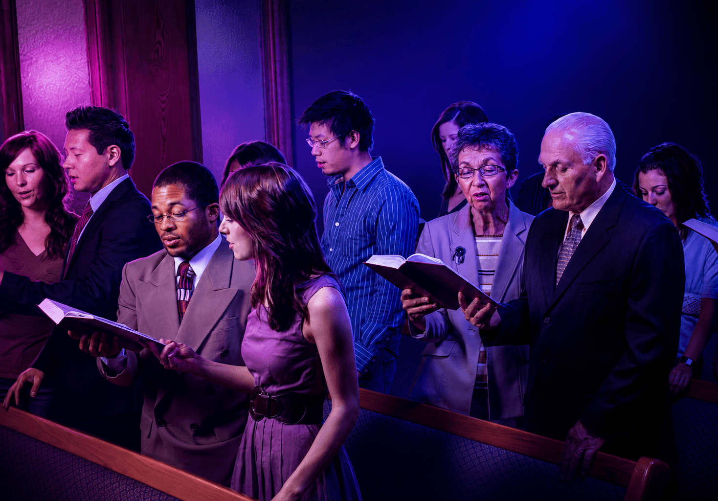 A congregation singing together from hymnals